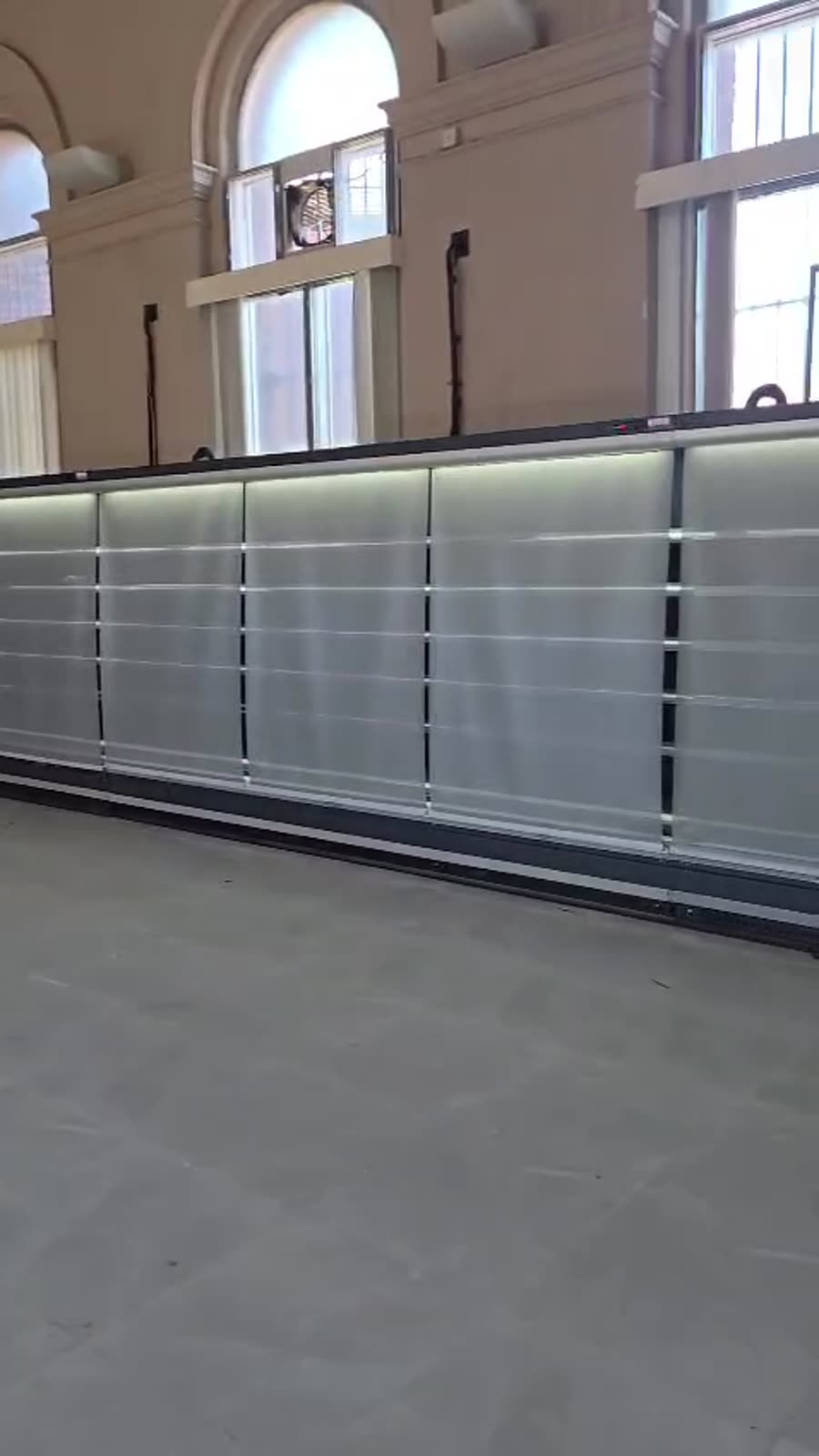 Long run of multideck display chillers with night blinds pulled down