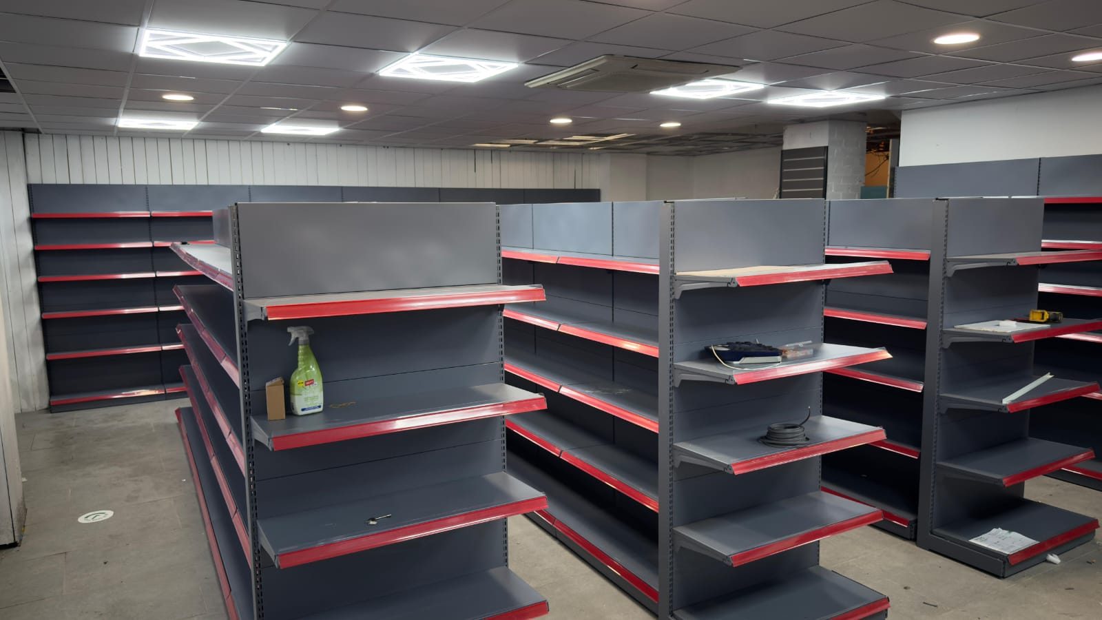 Grey and red gondola shelving installation